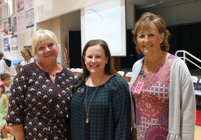 Submitted - Heather Coulter of Salisbury Academy, left, stands with Teen Aron and Krista Woolly of the Community Care Clinic of Rowan County after presenting a gift of $2,500 raised at the Bloom gala to the clinic.