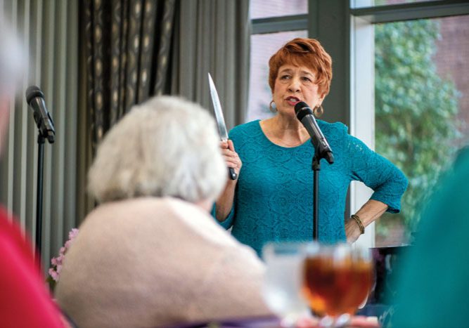 JON C. LAKEY/SALISBURY POST Mary Ann McCubbin entertains the attendees.  The annual Fashions for a Cause  was held at the Crystal Lounge at Catawba College on  Wednesday, April 10, benefitting Community Care Clinic. Salisbury, NC 4/10/19