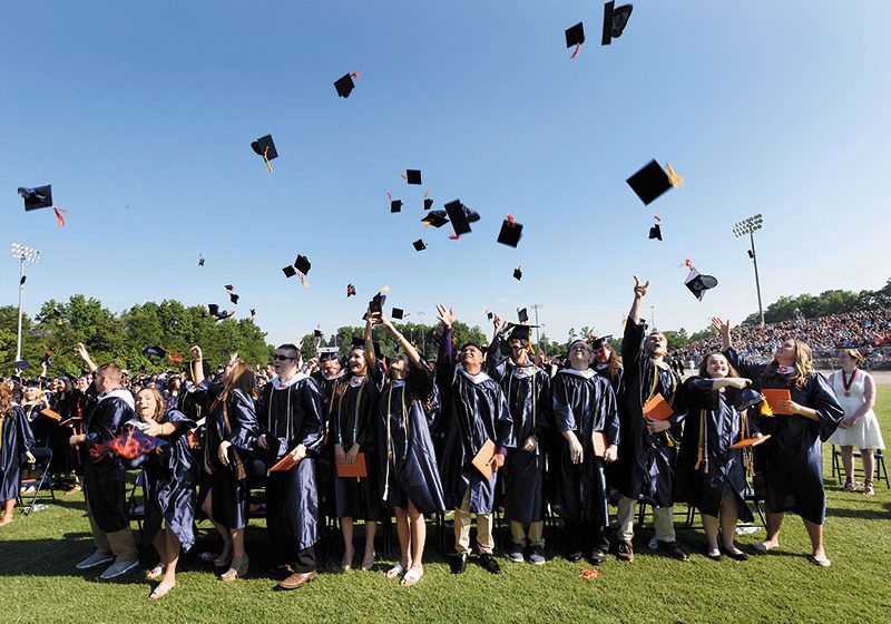 Graduation ceremony is over and the caps are  tossed into the air.  photo by Wayne Hinshaw, for the Salisbury Post